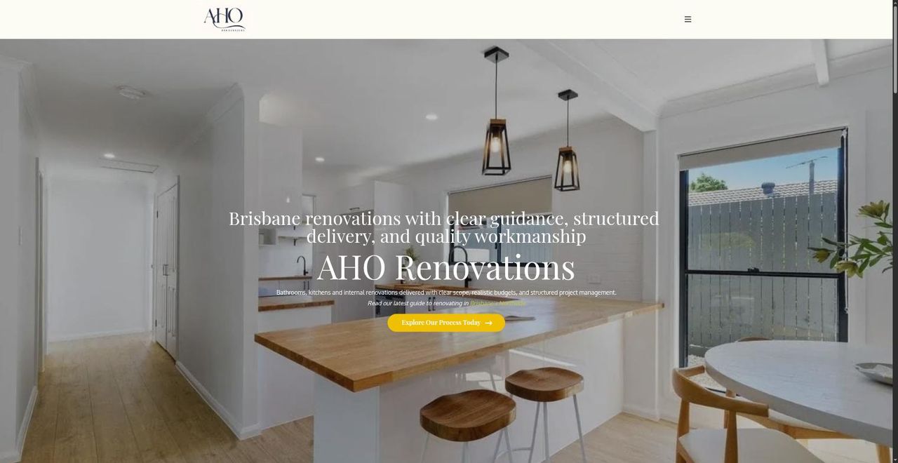 The previous AHO Renovations home page: a full-width photograph with the business name centred over it and a single button.